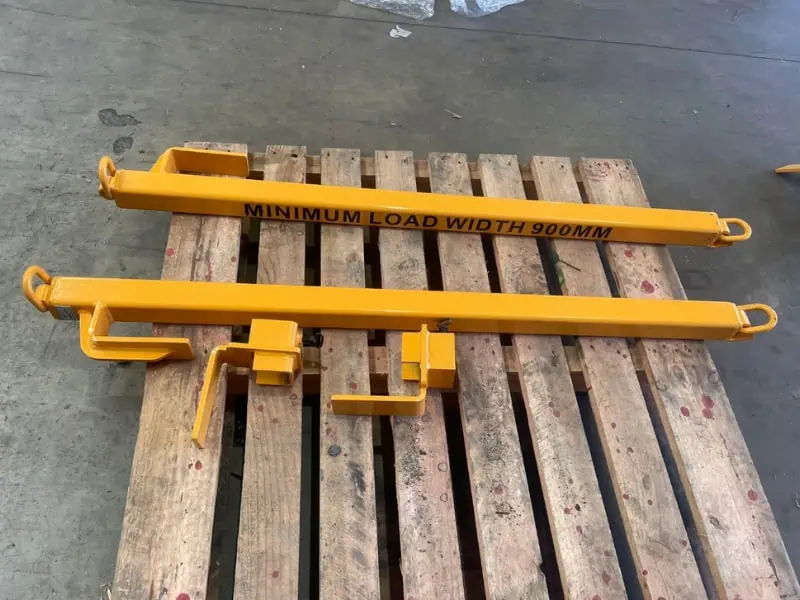 Bulk Material Handler yellow lifting attachments on pallet for load handling operations