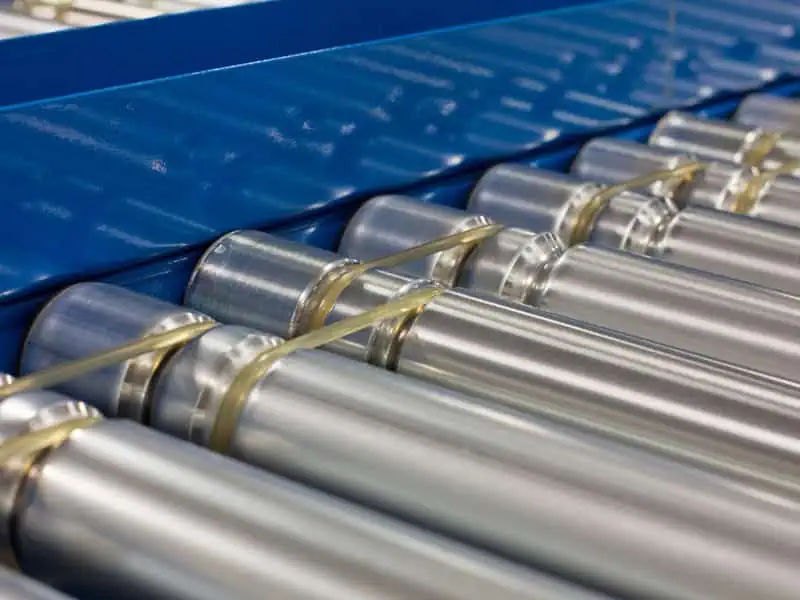 Close-up of roller conveyor application with steel rollers for smooth material handling in warehouse systems