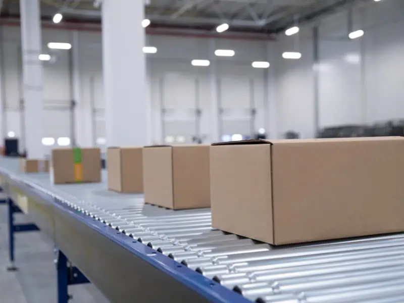 Roller Conveyor Uses for moving boxes efficiently across warehouse facility.