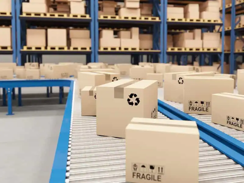 Conveyor Loading System moving fragile boxes across warehouse rollers.